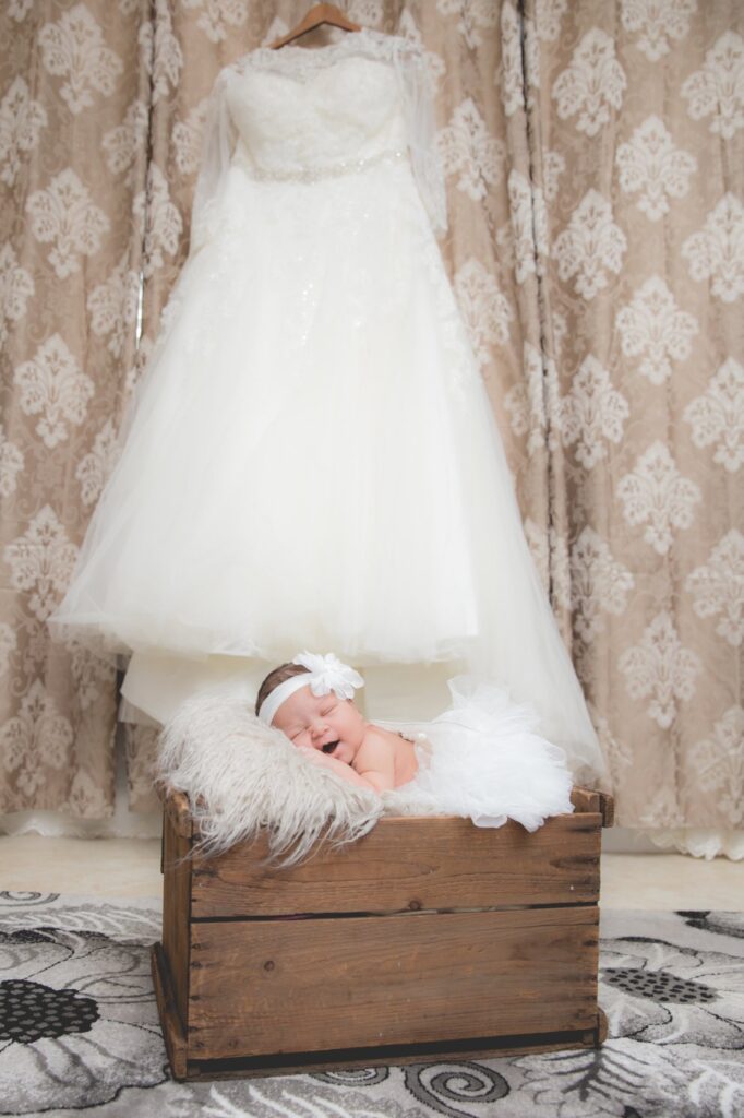 newborn and wedding dress