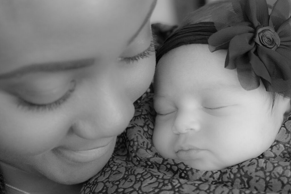 mom and newborn during newborn photo snoot