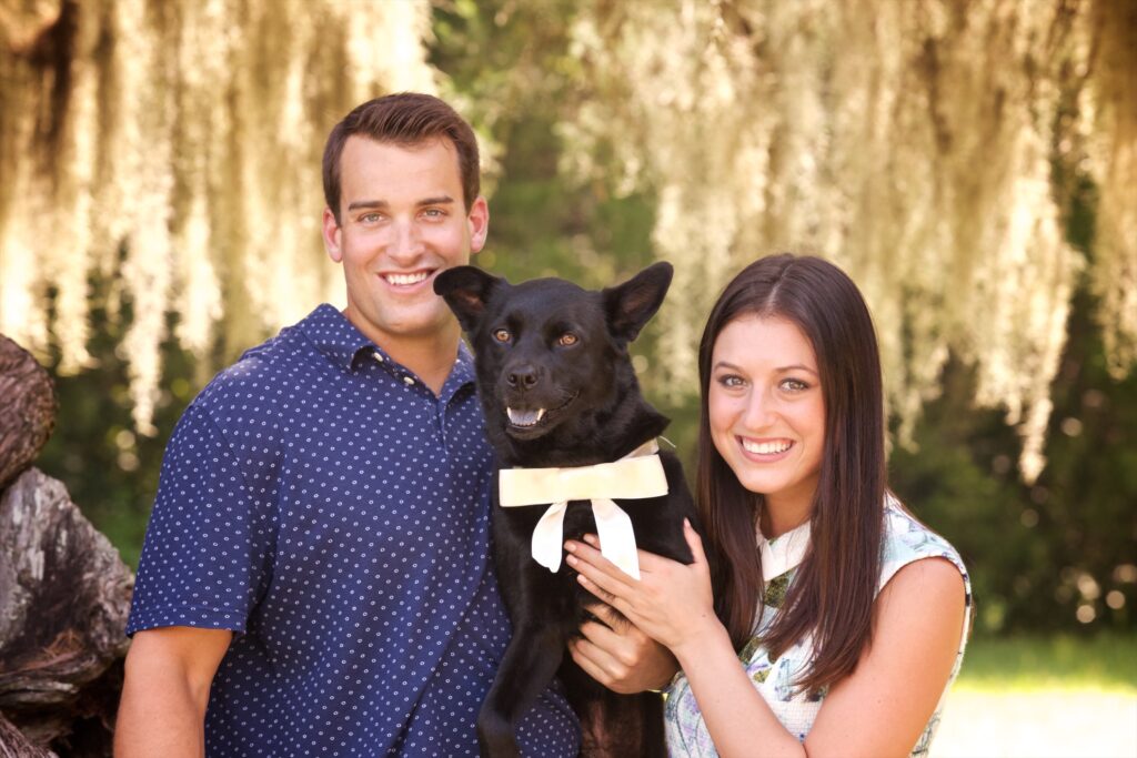 couple posing with their dog during their Tampa couple photoshoot