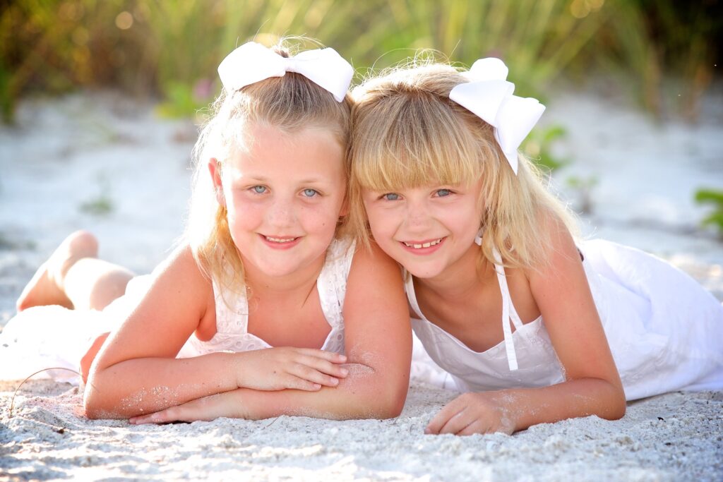 Two small girls posing on one of the best beach for photoshoots in Tampa - Anna Maria Island