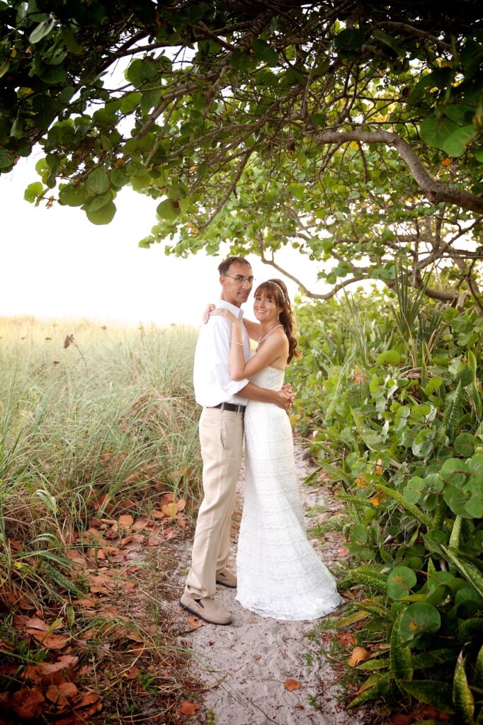 couple posing for wedding photos on Ana Maria Island near Tampa