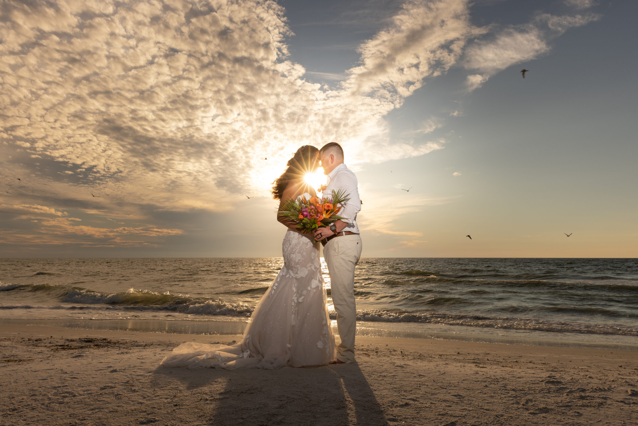 married couple on the beach at sunset - tampa wedding photography