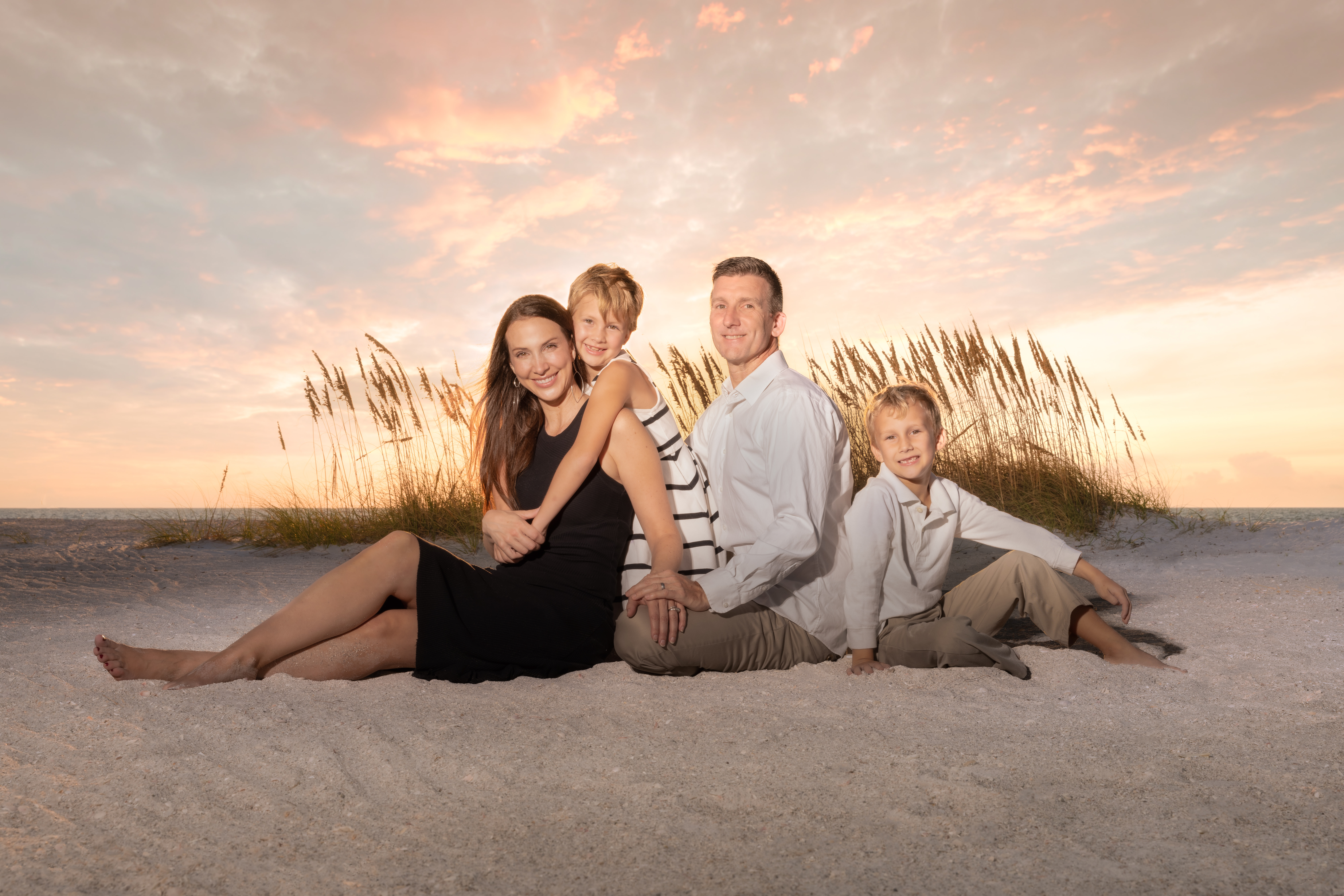 Family photo at sunset at Sand Key Beach in Clearwater